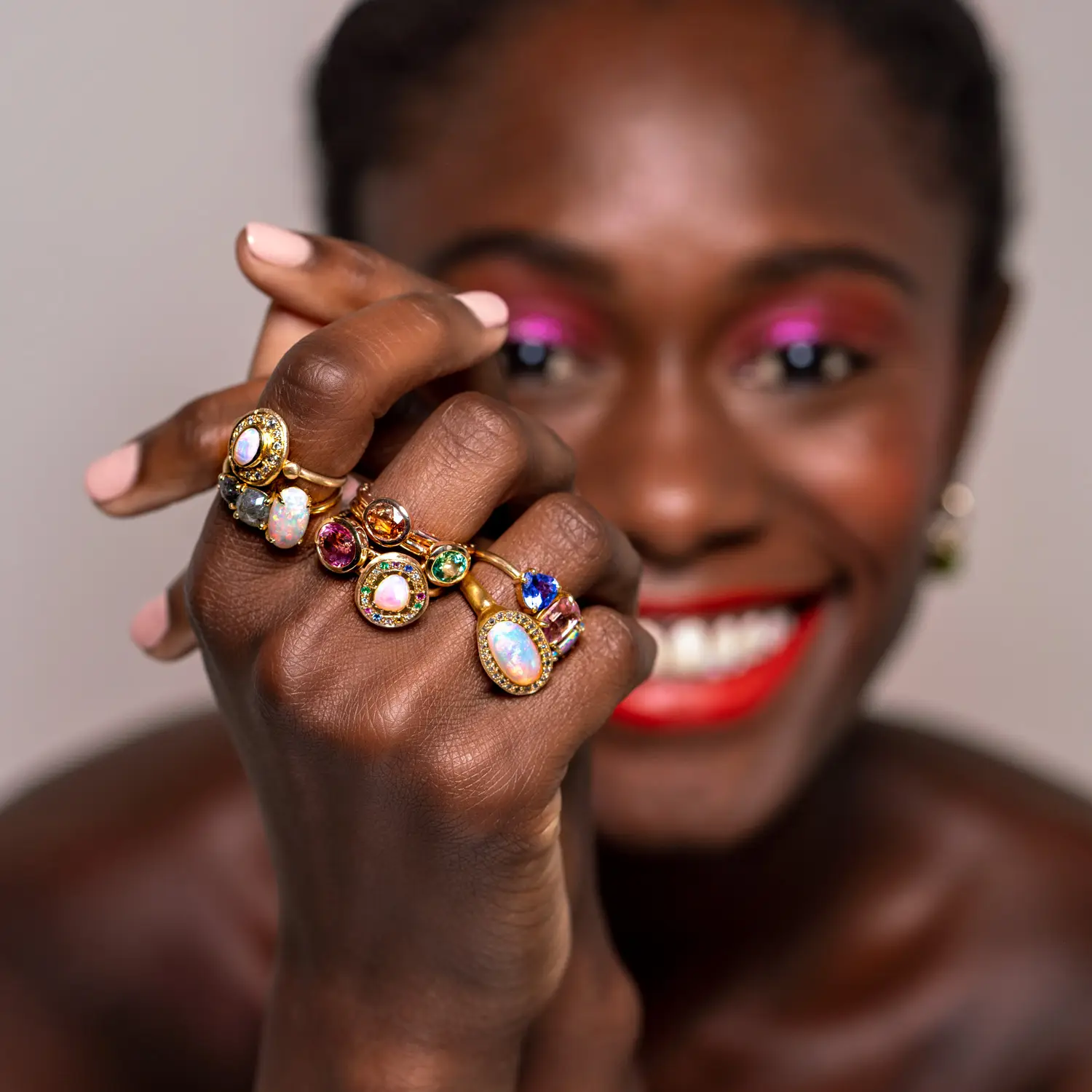 Amy from Stone Street Agency smiles wearing Sarah Gardner Jewellry for professional jewelry photography in Sydney