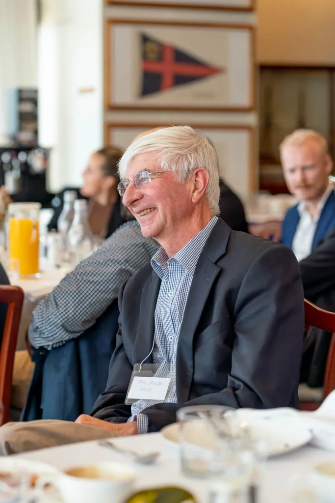 Close-up of attendee taking notes at net zero breakfast
