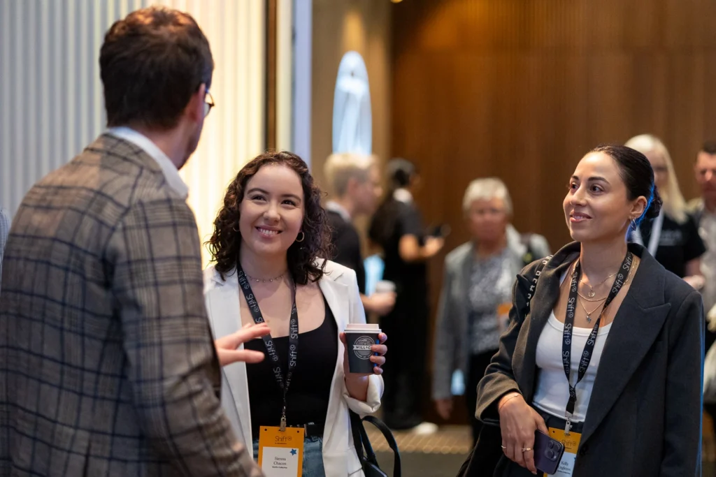 Guests in conversation at hospitality industry conference
