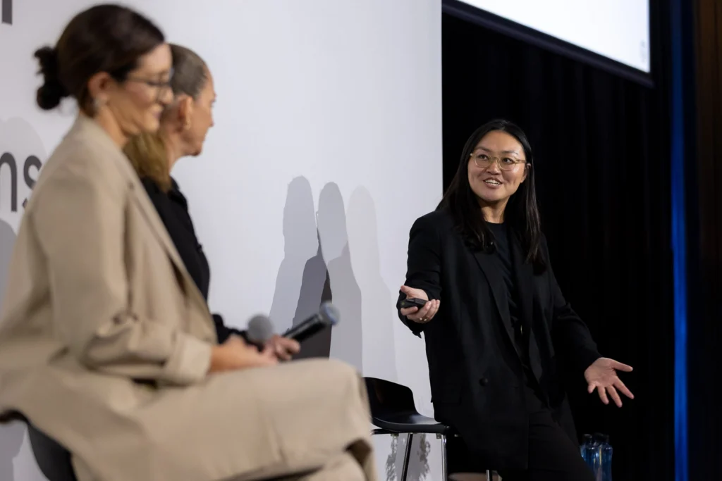 Close-up of panelist speaking on stage