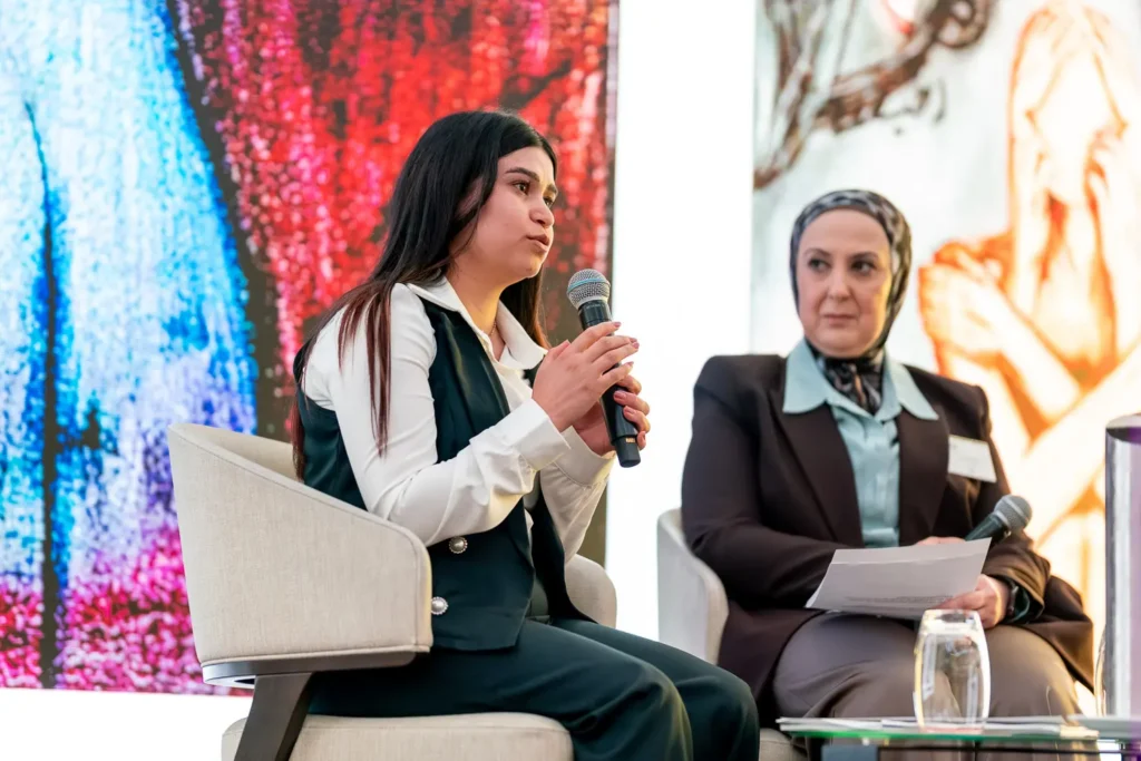 Amera Ali speaking during a panel discussion at the conference in Parramatta