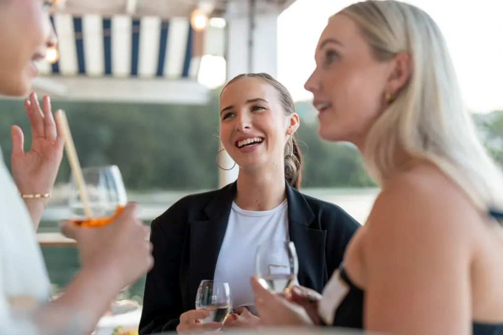Corporate guests networking over drinks at a Sydney Christmas event