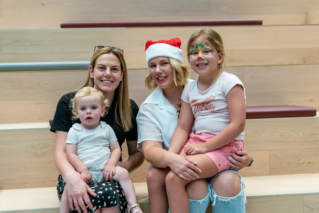 Family group portrait on venue steps at a Sydney Christmas party