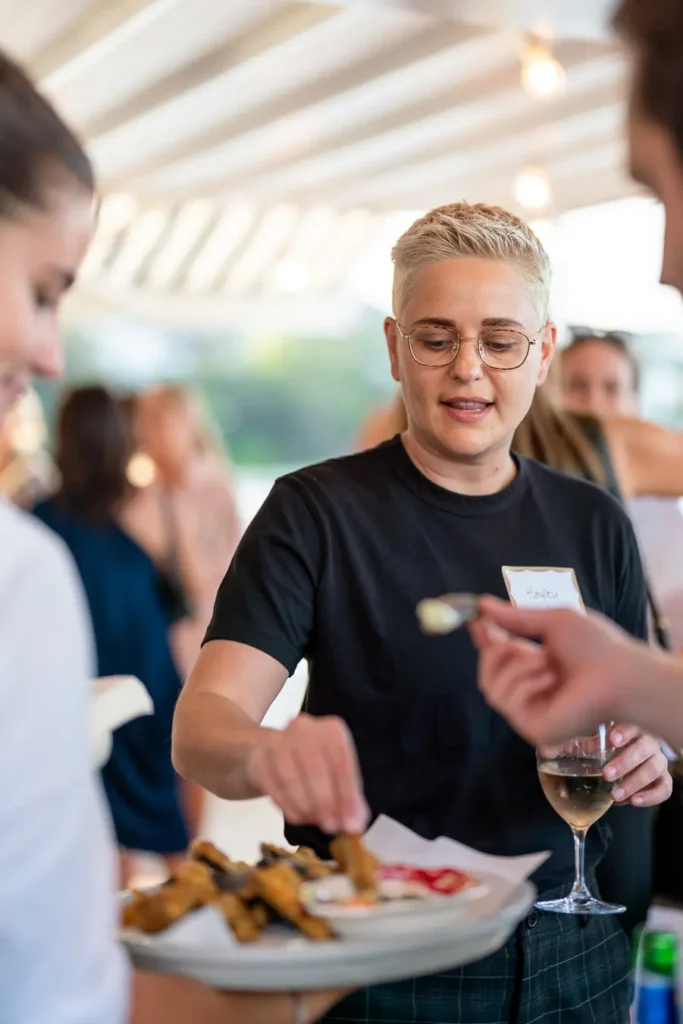 Guests enjoying food and drinks at a Sydney Christmas party function