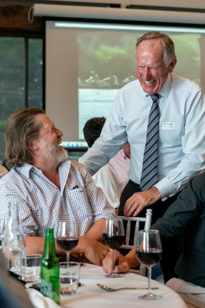 Guests laughing together during a Sydney Christmas function lunch
