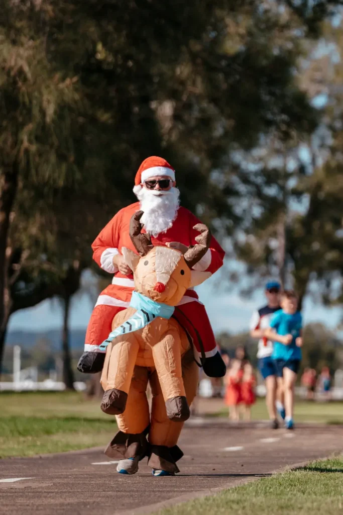 Participant in a Santa costume at a Sydney Christmas themed event