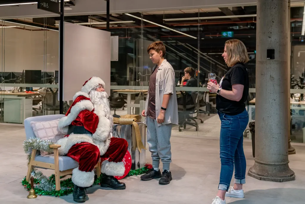 Santa meeting guests at a family-friendly Christmas function in Sydney