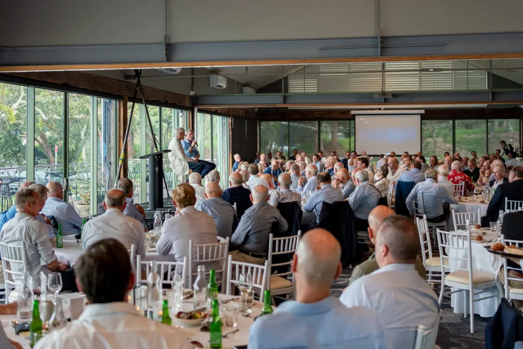 Speaker addressing guests at a Sydney Christmas function