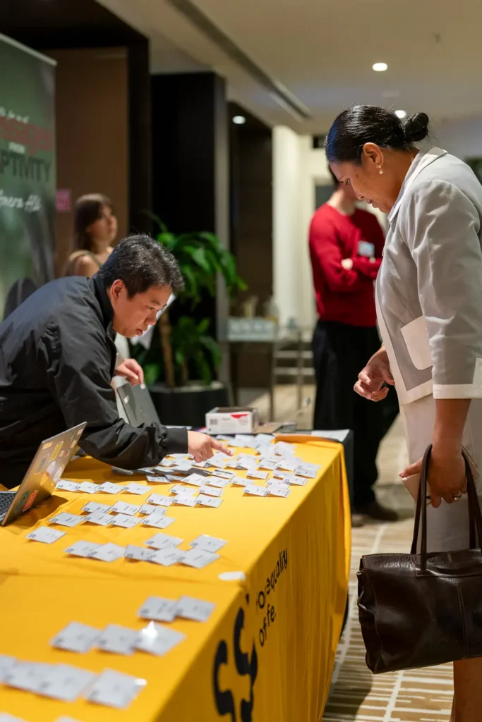 Guest checking in at the registration desk during the conference at PARKROYAL Parramatta