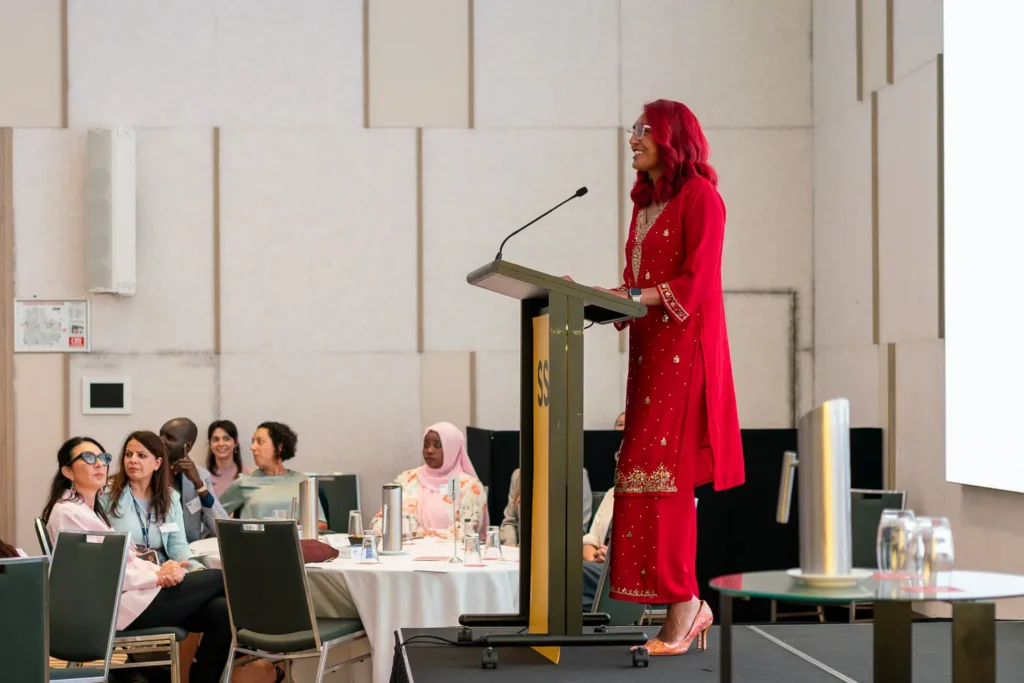 Rachael Jacobs presenting on stage during the International Women’s Day conference at PARKROYAL Parramatta