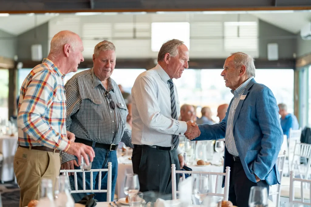 Guests greeting each other inside the Michael Morgan OAM lunch at Deckhouse Woolwich