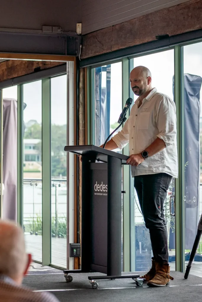 Speaker at the podium during the Michael Morgan OAM lunch at Deckhouse Woolwich