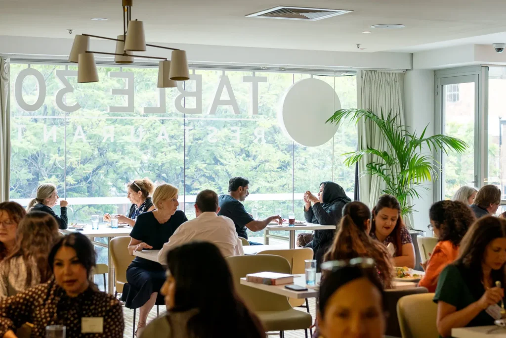 Guests seated for lunch and conversation at PARKROYAL Parramatta during the conference