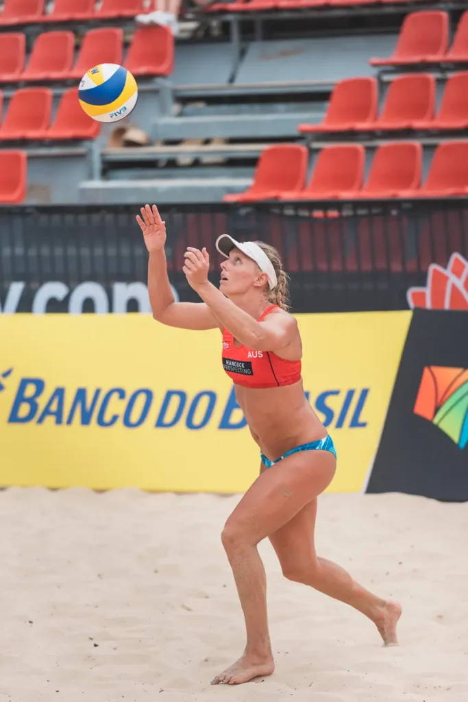Australian beach volleyball player tracking the ball during a rally