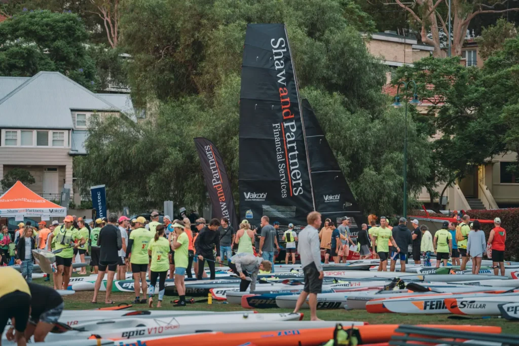 Athletes and supporters gathering at the Bay to Beach fundraising event village in Sydney