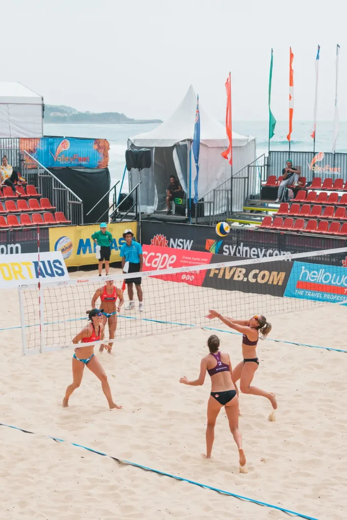 Canadian beach volleyball players setting the ball during a rally at Manly Beach