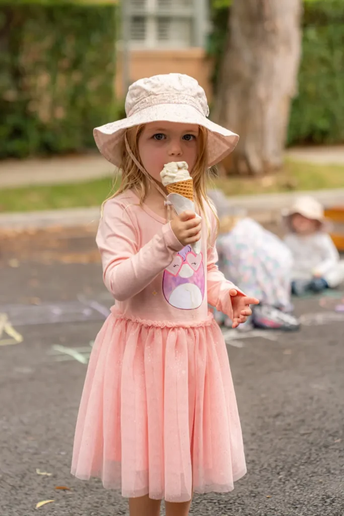 Young child enjoying free ice cream at Street Play Wollstonecraft