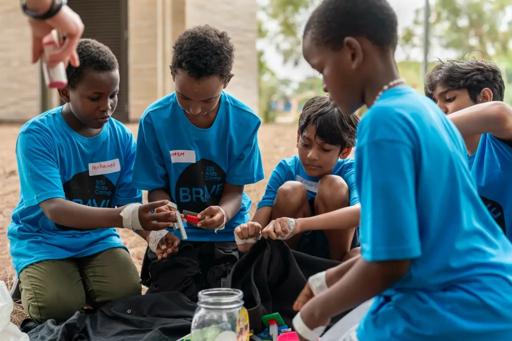 Kids working together during an outdoor collaboration and learning activity