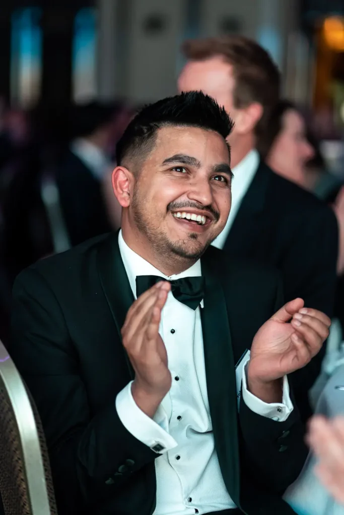 Guest applauding during Sydney corporate gala awards night