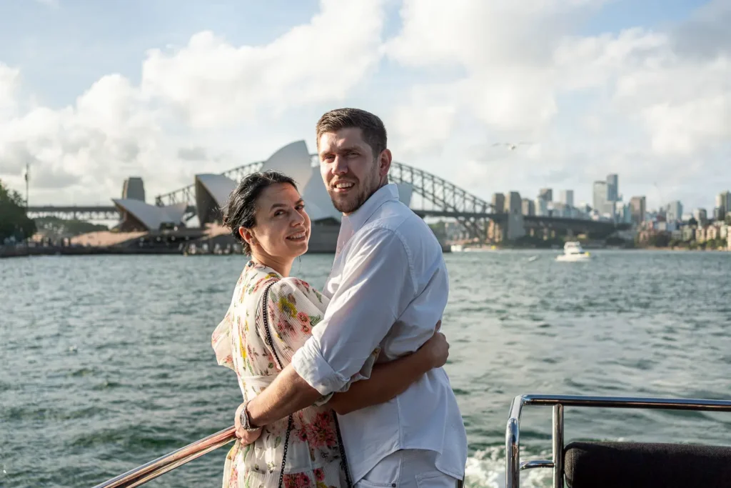 Couple enjoying executive yacht event on Sydney Harbour