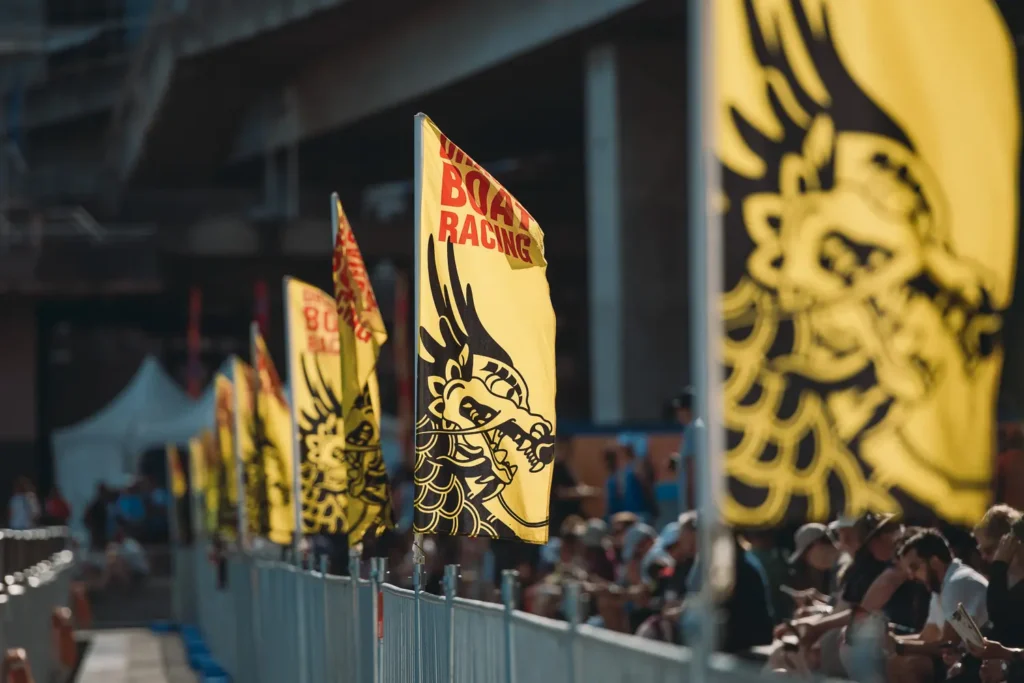 Yellow dragon boat racing flags lining the Sydney harbour promenade