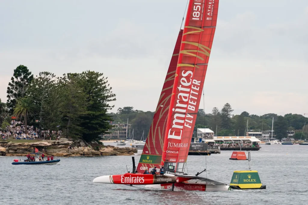 Emirates Great Britain SailGP F50 catamaran approaching a Rolex race marker on Sydney Harbour