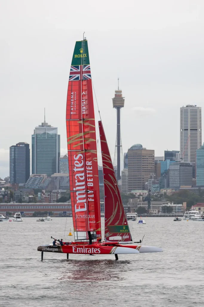 Emirates Great Britain SailGP boat racing with Sydney CBD skyline in the background