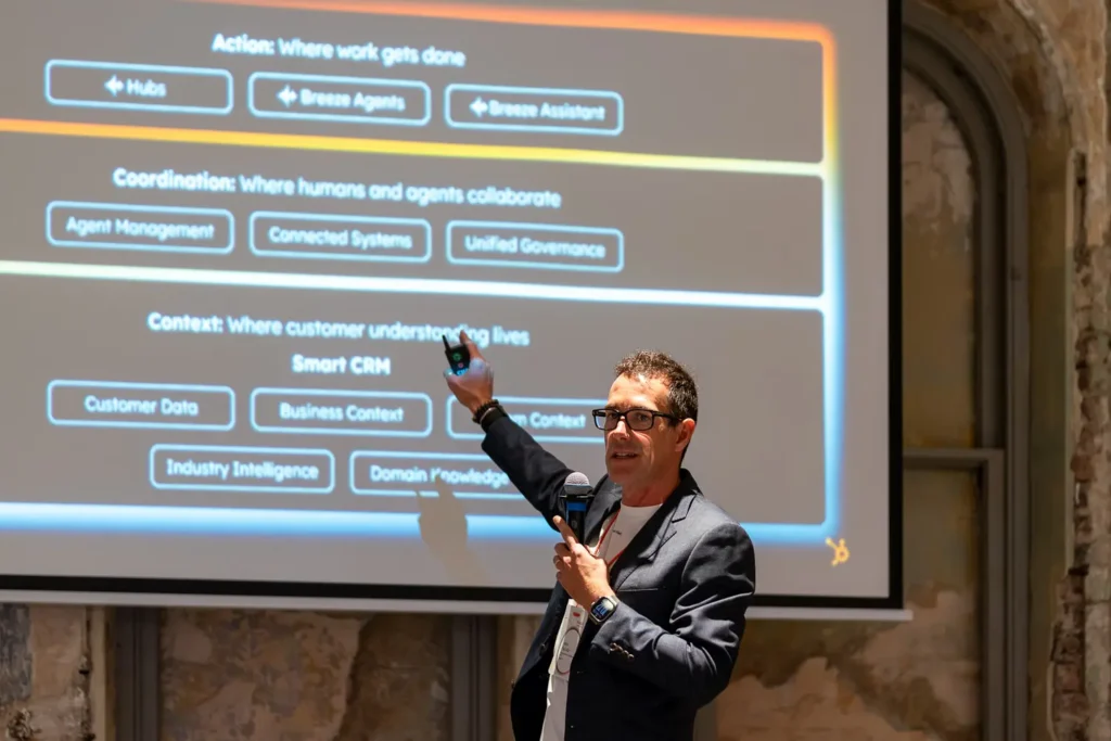 Fabio Pancaldi delivering an AI and CRM presentation during a corporate conference event