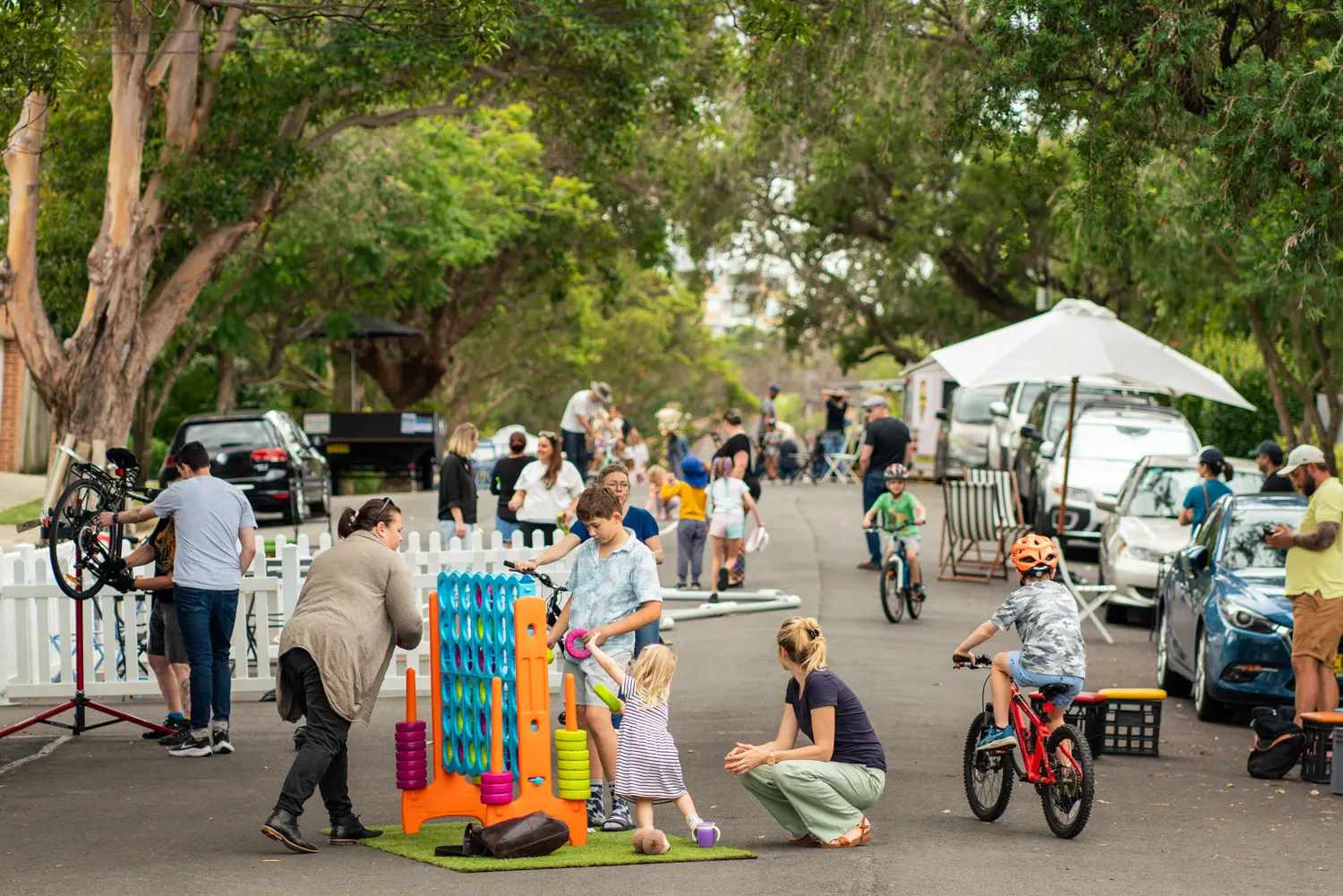 Families and children enjoying games and cycling during Street Play event