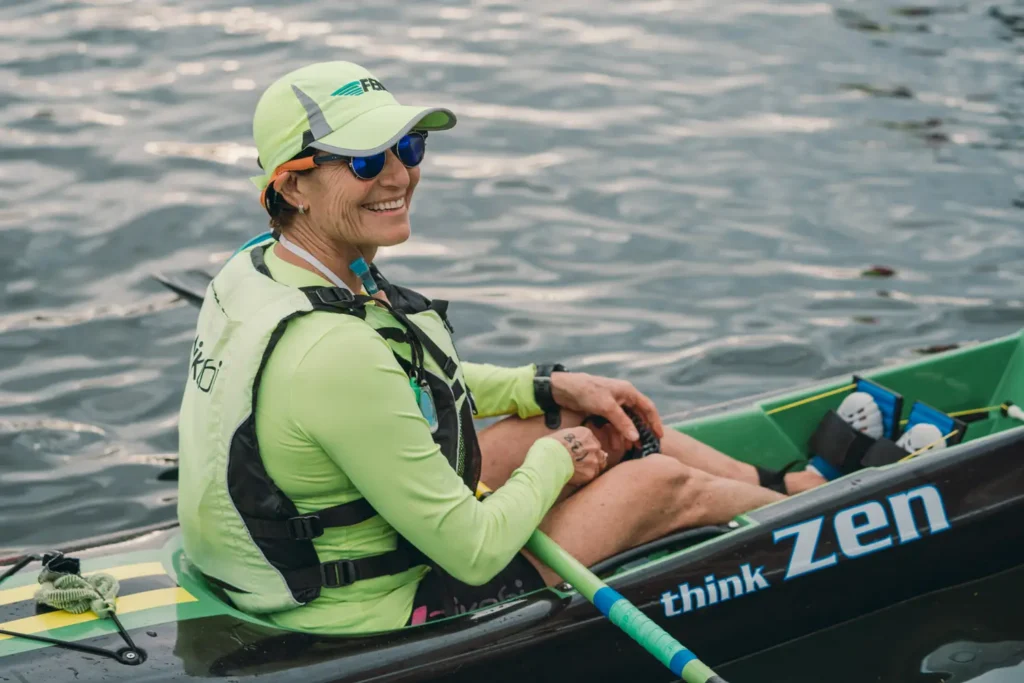 Female paddler smiling before the Sydney Harbour fundraising event