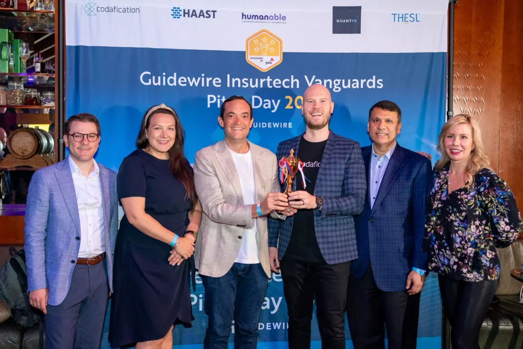 Guidewire Insurtech Vanguards Pitch Day winners posing with trophy at Four Seasons Sydney