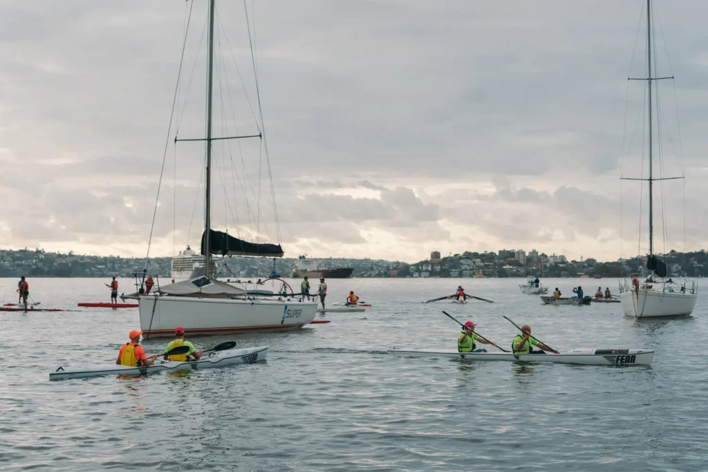 Rowing team competing during the Sydney Harbour fundraising race