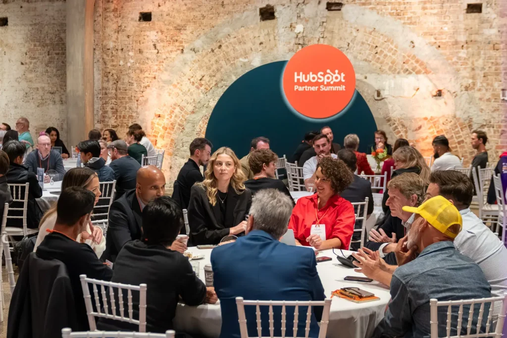 Large group of professionals networking and collaborating during the HubSpot Partner Summit at Alpha Dining Sydney conference venue