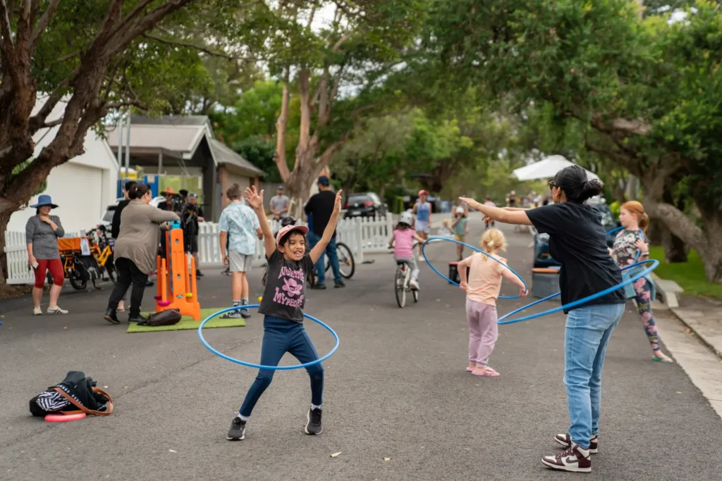 Children playing with hula hoops during Wollstonecraft Street Play event
