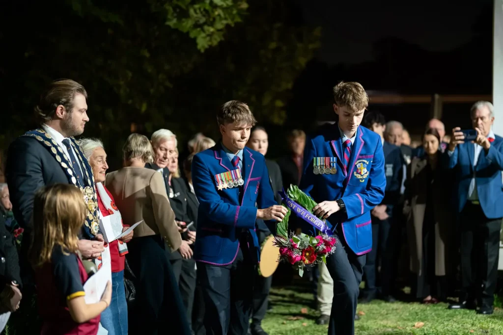 School students laying a wreath during the Hunters Hill ANZAC service