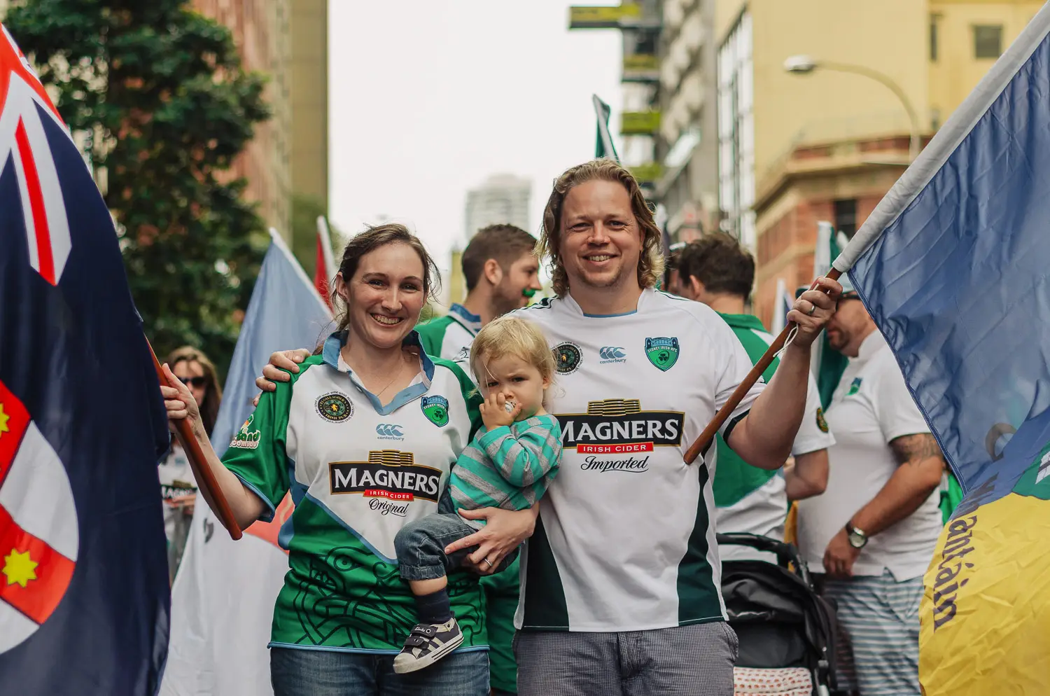 Family holding Irish flags at the Sydney St Patrick’s Day Parade