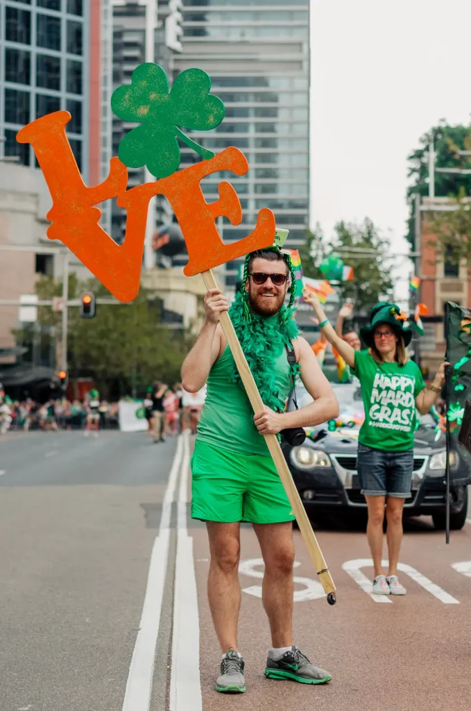 Parade participant holding love sign during Sydney St Patrick’s Day celebration