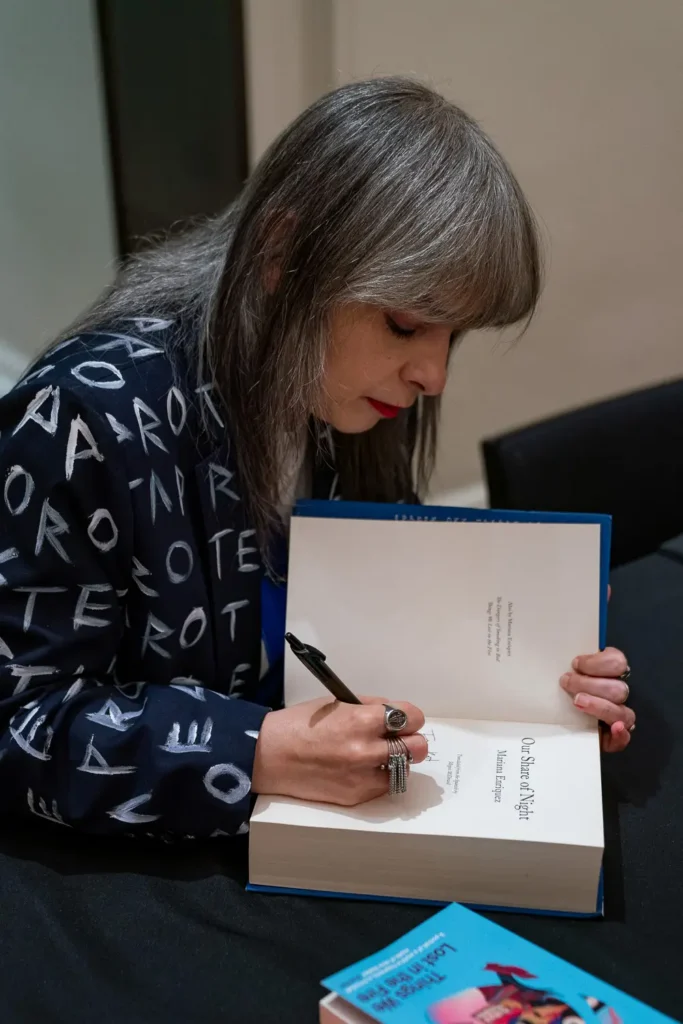 Mariana Enriquez signing copies of Our Share of Night at Melbourne Writers Festival