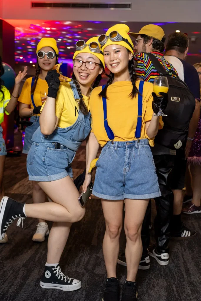 Team members dressed as Minions at a themed corporate party in Sydney