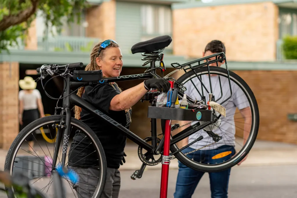 Free bicycle maintenance service by Pedal Set Go during community event