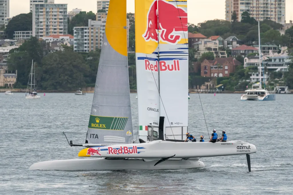 Red Bull Italy SailGP F50 catamaran foiling across Sydney Harbour during SailGP competition