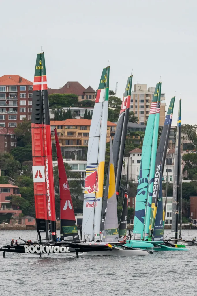 ROCKWOOL Denmark SailGP F50 catamaran lined up beside other SailGP teams on Sydney Harbour