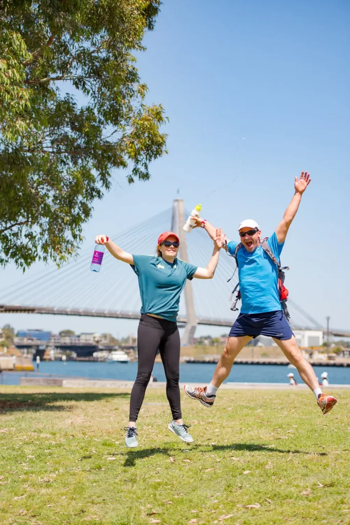 Participants celebrating during the Seven Bridges Walk Sydney charity event