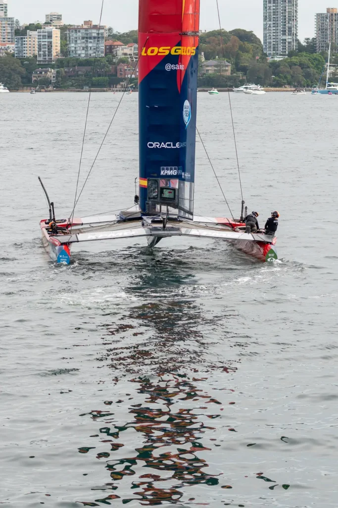 Front-on view of the Spain SailGP F50 catamaran floating on Sydney Harbour during SailGP practice racing