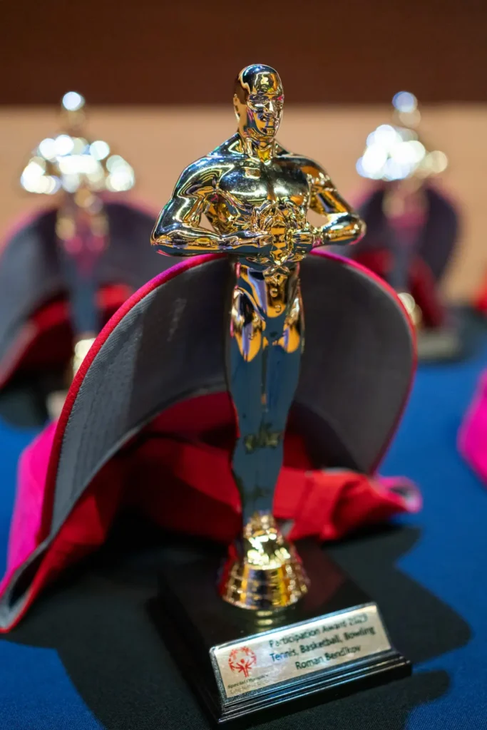 Close-up of sports achievement trophy at Special Olympics awards ceremony
