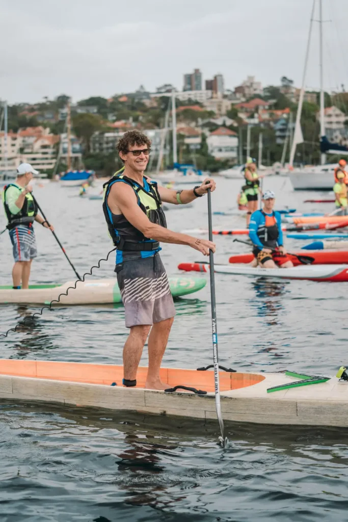 Paddleboard athlete during the Bay to Beach charity race on Sydney Harbour