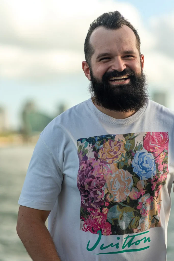 Corporate guest smiling aboard Sydney Harbour executive boat event