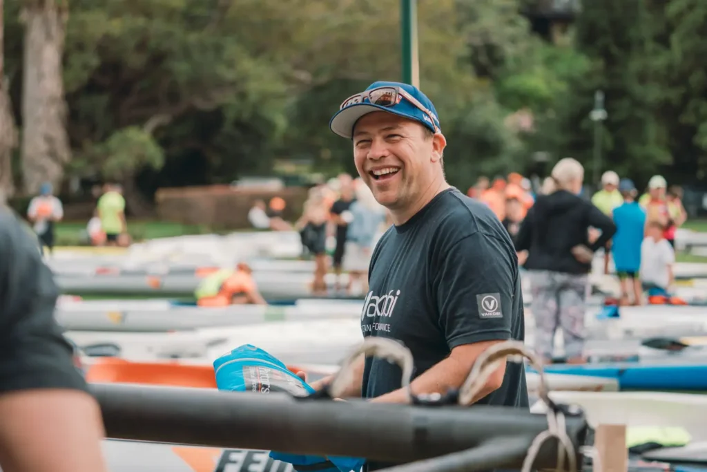 Athletes preparing kayaks before the Sydney Harbour charity race