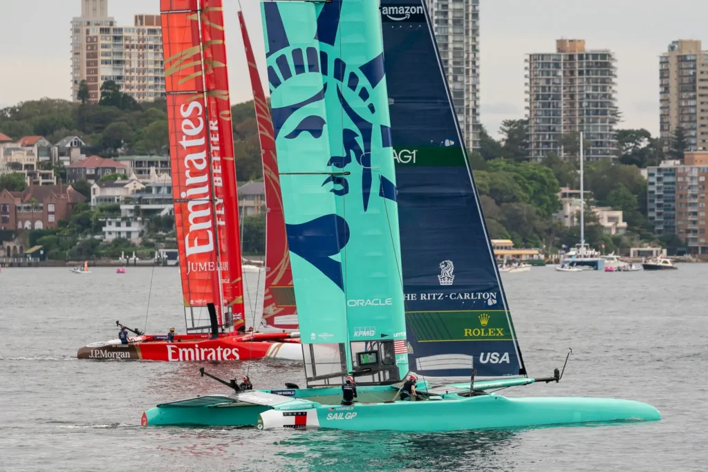 USA SailGP F50 catamaran sailing beside the Emirates Great Britain team on Sydney Harbour