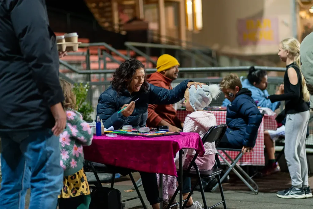 Face painting activity for families at the Matildas live site at North Sydney Oval